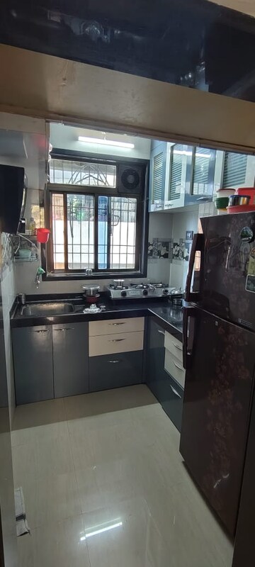 Kitchen in 1 BHK Apartment at Seawoods Sector 36 – for Sale