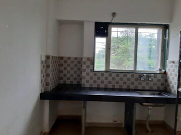 Kitchen in 1 BHK Apartment at Raj Heramb Regalia Residency, Bavdhan – for Rent