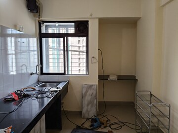 Kitchen in 2 BHK Apartment at Ram Pushpanjali Residency, Owale – for Sale