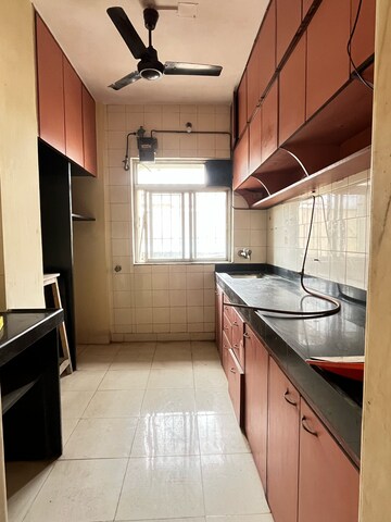 Kitchen in 2 BHK Apartment at New Brahmand Phase 7 CHS, Kiran Mill Colony – for Sale