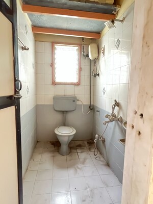 Bathroom in 2 BHK Apartment at New Brahmand Phase 7 CHS, Kiran Mill Colony – for Sale