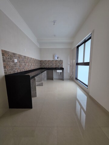 Kitchen in 4 BHK Apartment at Raj Infinia, Malad West – for Rent