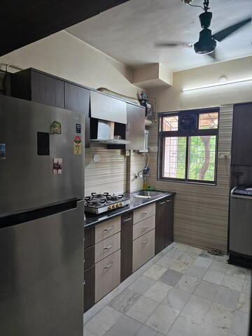 Kitchen in 2 BHK Apartment at Sahayog Complex, Manpada – for Rent