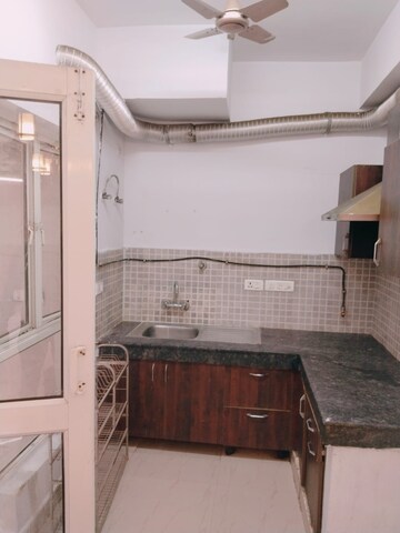 Kitchen in 2.5 BHK Apartment at Nimbus The Golden Palm, Sector 168 – for Rent