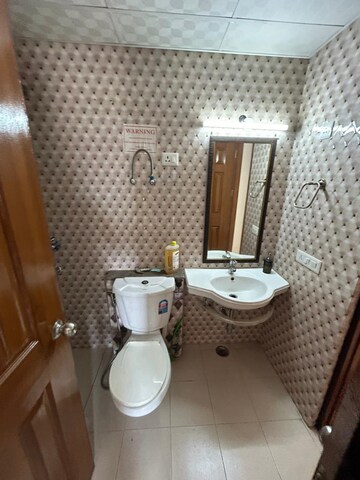 Bathroom in 4 BHK Apartment at Purvanchal Royal City, Chi V Greater Noida – for Rent