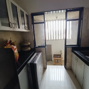 Kitchen in 2 BHK Apartment at Ganesh CHS Andheri West, Dn Nagar – for Rent