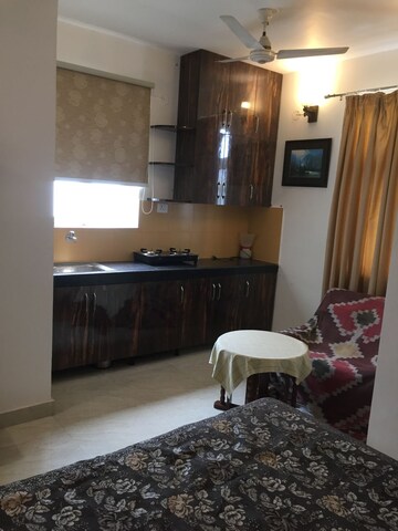 Living Room in Studio Builder Floor at Panchshil Avant Garde, New Friends Colony – for Rent