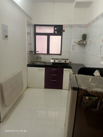 Kitchen in 1 BHK Apartment at Yashraj Park CHS, Kasarvadavali – for Rent