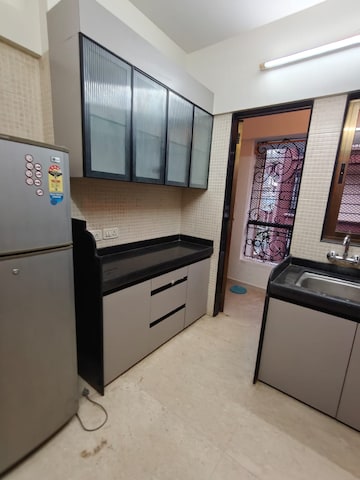 Kitchen in 2 BHK Apartment at S Raheja New Light, Khar West – for Rent
