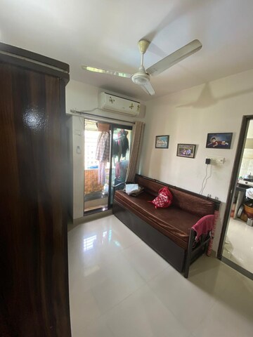 Living Room in 1 BHK Apartment at Haware Dahlia, Kasarvadavali – for Sale