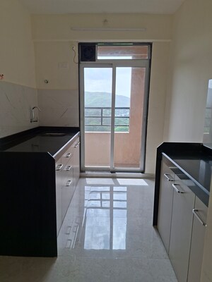 Kitchen in 1 BHK Apartment at Mahavir Kalpavruksha, Ghodbunder Road – for Sale