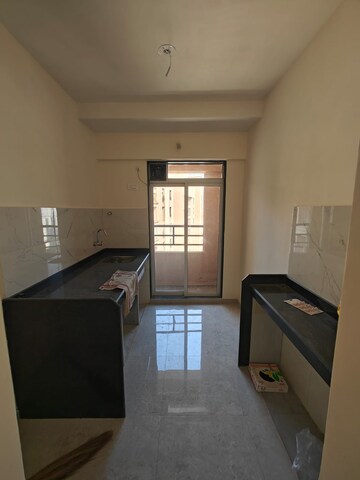 Kitchen in 2 BHK Apartment at Mahavir Kalpavruksha, Ghodbunder Road – for Rent