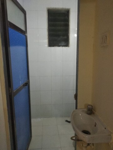 Bathroom in 1 BHK Apartment at Suryodaya Apartments, Seawoods Sector 48 – for Rent