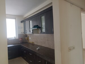 Kitchen in 3 BHK Apartment at 3C Lotus Boulevard, Sector 100 – for Sale