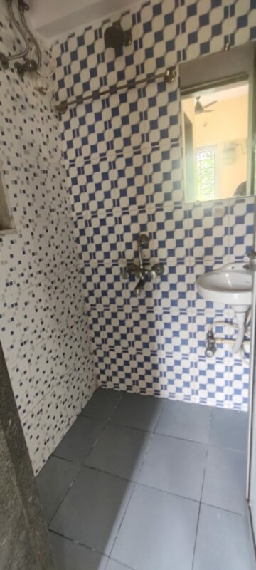 Bathroom in 1 BHK Apartment at Om Kalyani CHS, Dahisar West – for Rent