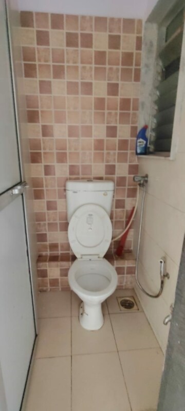 Bathroom in 1 BHK Apartment at Om Kalyani CHS, Dahisar West – for Rent
