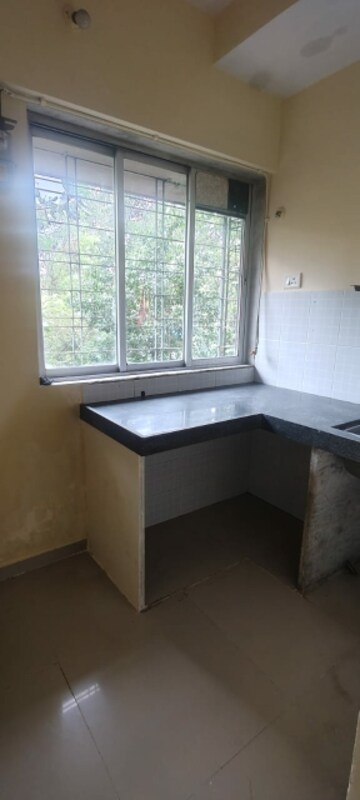 Kitchen in 1 BHK Apartment at Om Kalyani CHS, Dahisar West – for Rent