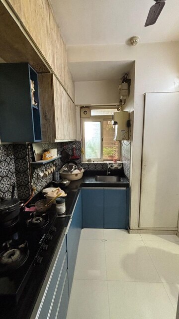Kitchen in 3 BHK Apartment at Cosmos Jewels, Ghodbunder Road – for Rent