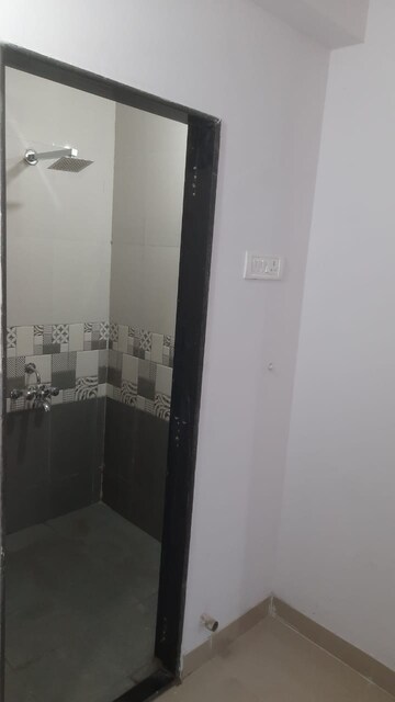 Bathroom in 1 BHK Apartment at Unnat Nagar CHS, Goregaon West – for Rent