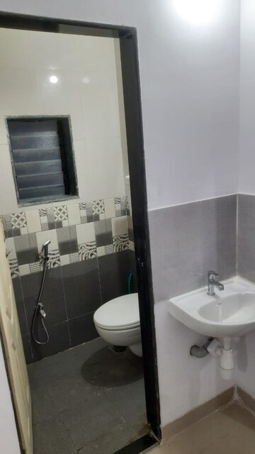Bathroom in 1 BHK Apartment at Unnat Nagar CHS, Goregaon West – for Rent