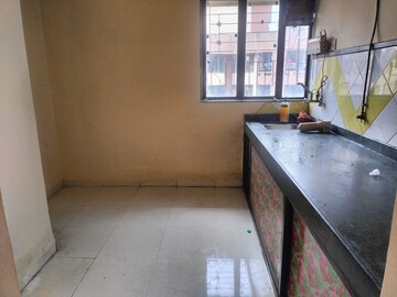 Kitchen in 1 BHK Apartment at Garden Court, Waghbil – for Rent