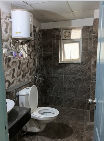 Bathroom in 3 BHK Apartment at Shri Radha Sky Gardens, Sector 16b Greater Noida – for Rent