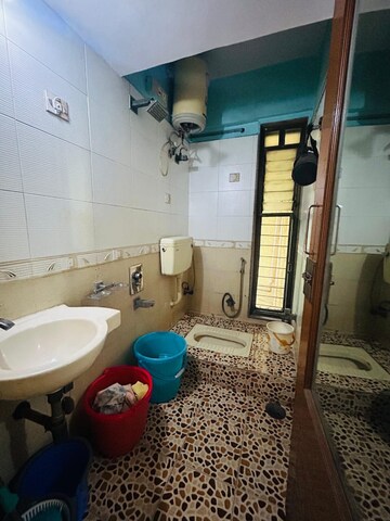 Bathroom in 2 BHK Apartment at Kopar Khairane Sector 1 – for Rent