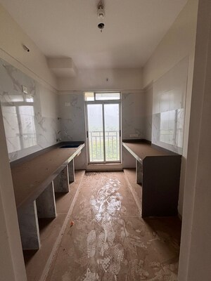 Kitchen in 1.5 BHK Apartment at Vihang Vermont, Ghodbunder Road – for Sale