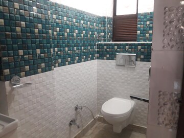 Bathroom in 3 BHK Apartment at Rohini Sector 14 – for Rent