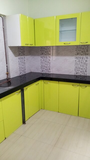 Kitchen in 2 BHK Apartment at Unnathi Woods Phase 1 And 2, Ghodbunder Road – for Rent