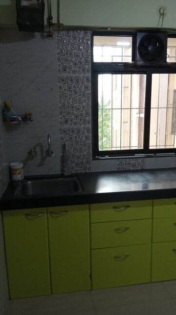 Kitchen in 2 BHK Apartment at Unnathi Woods Phase 1 And 2, Ghodbunder Road – for Rent
