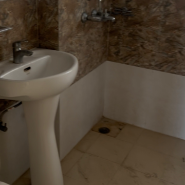Bathroom in 2 BHK Apartment at Antriksh Golf City, Sector 150 – for Rent