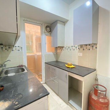 Kitchen in 2 BHK Apartment at Signature Orchard Avenue 2, Hayatpur – for Rent