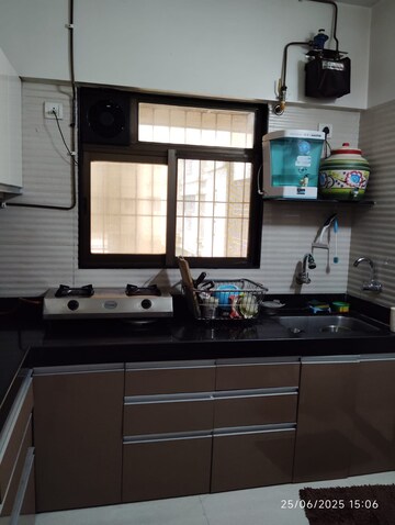 Kitchen in 2 BHK Apartment at Cosmos Jewels, Ghodbunder Road – for Rent