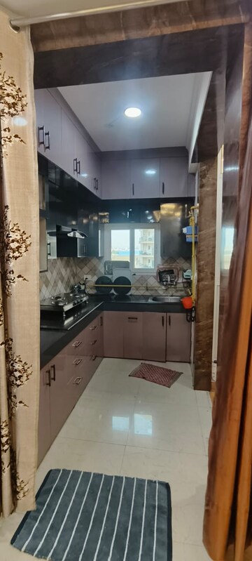 Kitchen in 2 BHK Apartment at Nilaya Greens, Raj Nagar Extension – for Sale