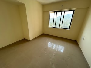 Room in 2 BHK Apartment at Pushpanjali Heights, Owale – for Sale