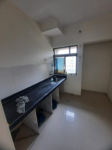 Kitchen in 1 BHK Apartment at Squarefeet Ace Square phase 2, Ghodbunder Road – for Sale