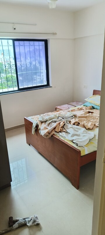 Bedroom in 2 BHK Apartment at Hill Mist Harmony Co-op Housing Society, Kondhwa – for Rent
