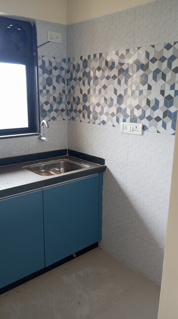 Kitchen in 1 BHK Apartment at Raunak Unnathi Woods Phase 7 A And B, Ghodbunder Road – for Sale
