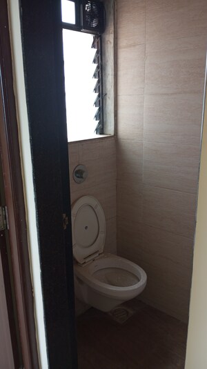 Bathroom in 1 BHK Apartment at Raunak Unnathi Woods Phase 7 A And B, Ghodbunder Road – for Sale