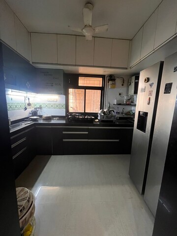 Kitchen in 2.5 BHK Apartment at Uma Sparta, Ghodbunder Road – for Sale