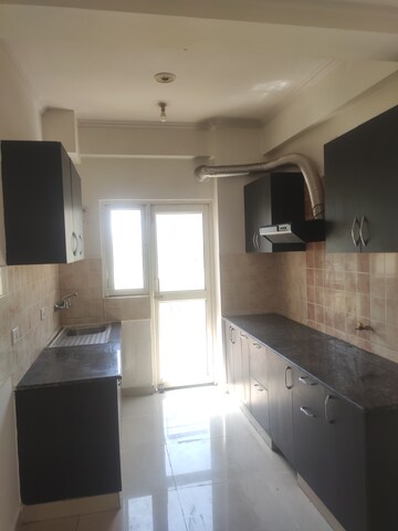 Kitchen in 2 BHK Apartment at Aims Golf City, Sector 75 – for Rent