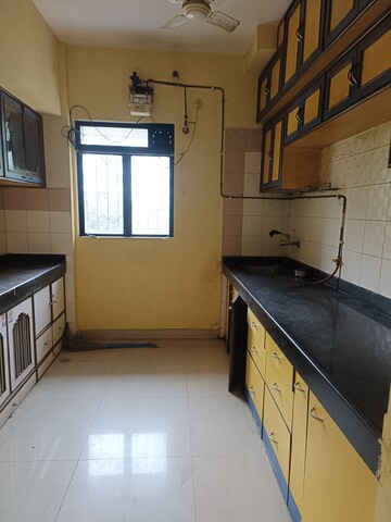 Kitchen in 1 BHK Apartment at Cosmos Heritage, Manpada – for Rent