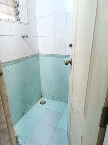 Bathroom in 1 BHK Apartment at Cosmos Heritage, Manpada – for Rent