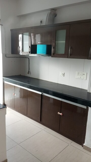 Kitchen in 2 BHK Apartment at Amrapali Eden Park, Sector 50 – for Rent