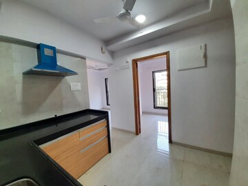 Kitchen in 1.5 BHK Apartment at Prayag Heights, Dindoshi – for Sale