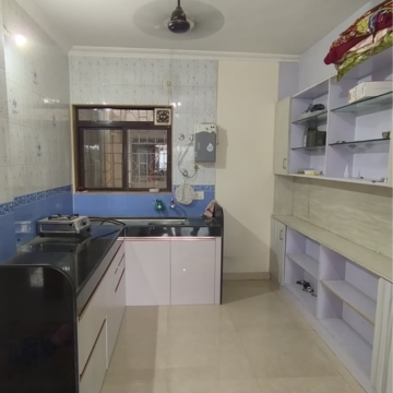 Kitchen in 2 BHK Apartment at Sudhir Mandke Advantage CHS, Lulla Nagar – for Rent