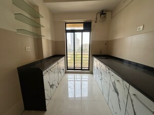 Kitchen in 2 BHK Apartment at Mahavir Kalpavruksha, Ghodbunder Road – for Sale