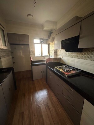 Kitchen in 2.5 BHK Apartment at Swastik Residency 1, Ghodbunder Road – for Sale