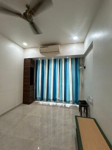 Living Room in 2 BHK Apartment at Harmony Signature Towers, Owale – for Rent